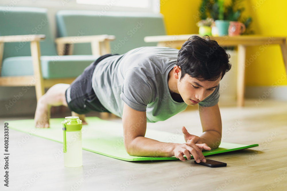 Asian man doing exercise at home