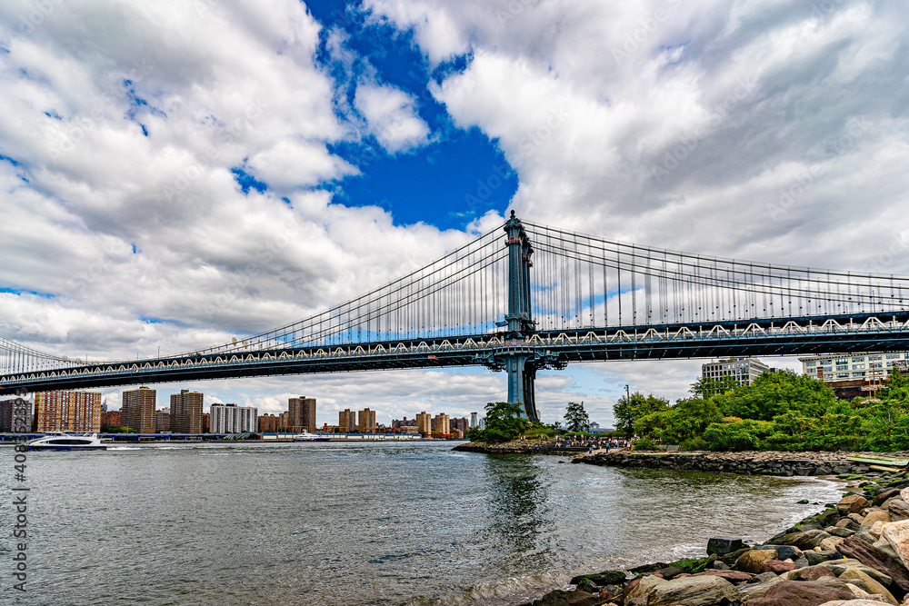 Manhattan Bridge over East River and waterfront condominium Manhattan New York City Wide angle view