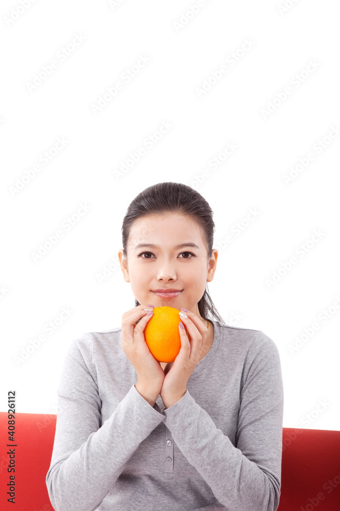 东方时尚女性手持橙色