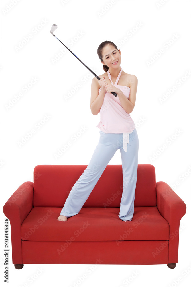 Oriental fashion female with a golf club