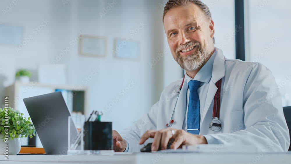 Middle Aged Family Medical Doctor with a Beard is Working in a Health Clinic. Successful Senior Phys