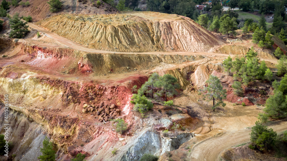 Sulfide deposits in Kokkinopezoula open-pit mine in Mitsero, Cyprus. Aerial view on colorful landsca