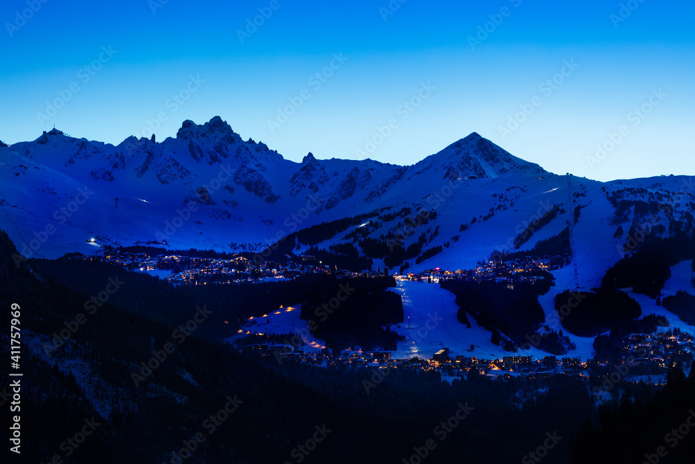 Evening panorama of Courchevel valley and ski resort with Alps mountain peaks view from Champagny-en