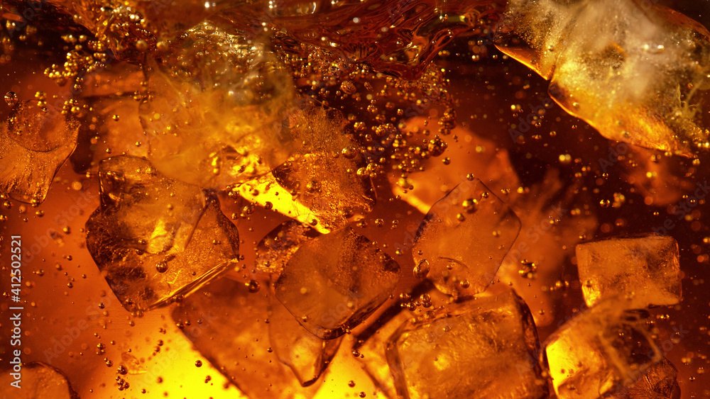 Detail of cola or alcoholic drink with ice cubes