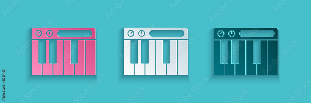 蓝色背景上孤立的剪纸音乐合成器图标。电子钢琴。纸艺风格。Vec