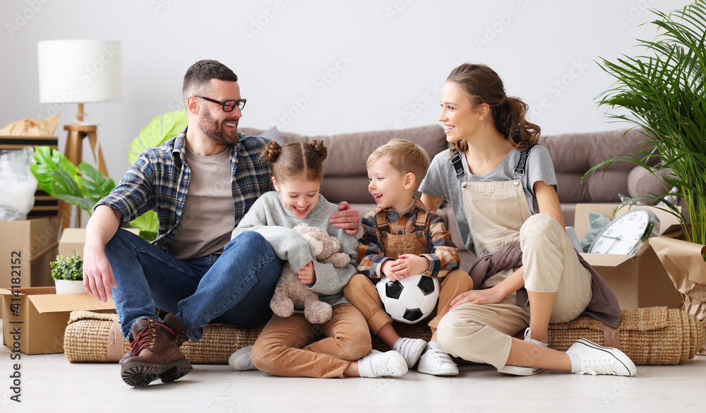 Cheerful family sitting of floor in new apartment