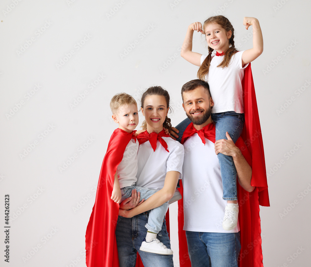 Happy family in Superhero capes