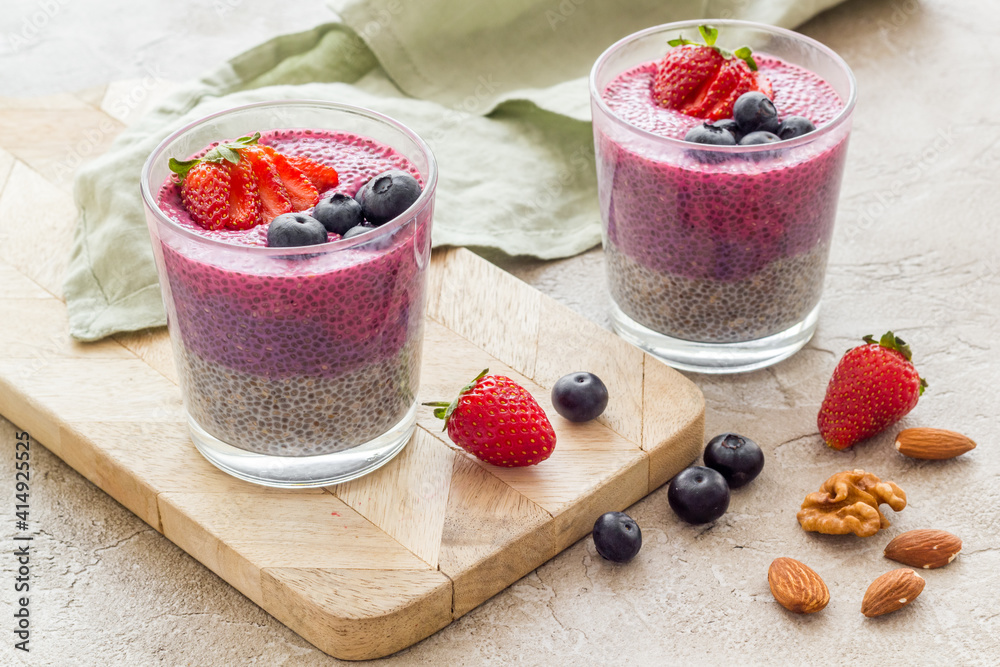 Smoothie and chia seeds pudding with strawberries in glasses