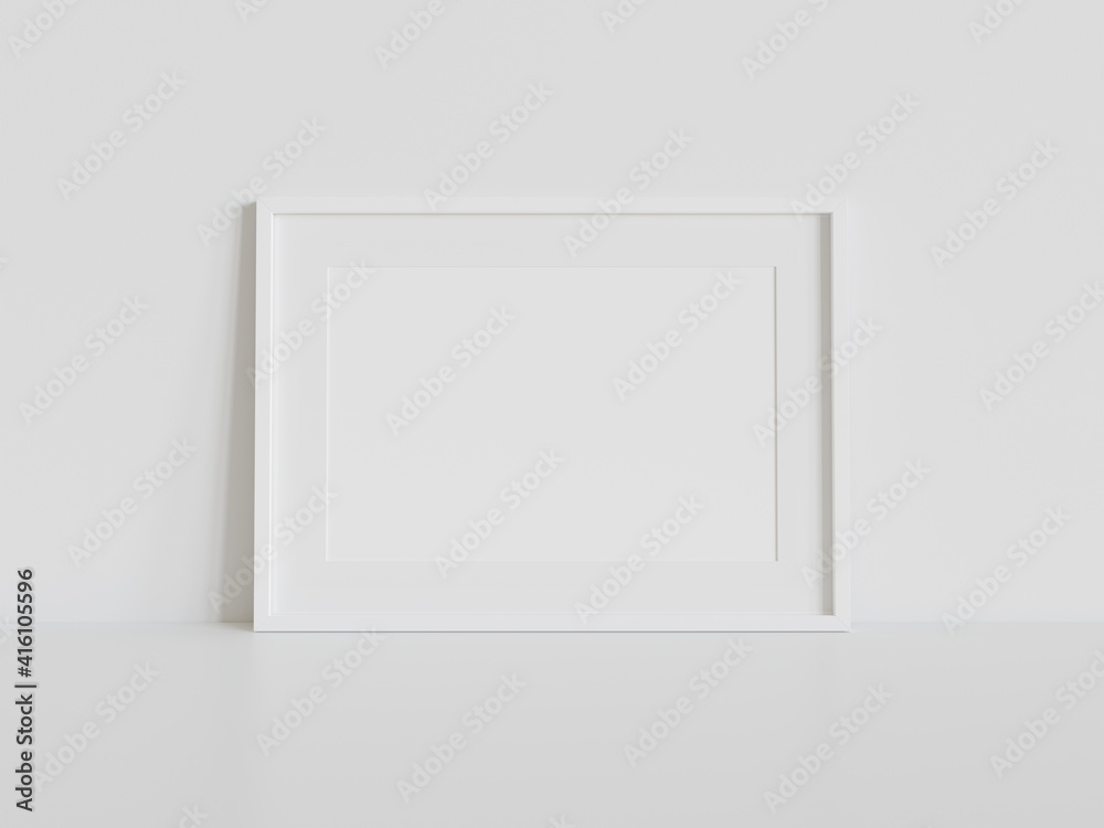 室内模型中白色框架靠在白色地板上。墙上相框的模板3D ren