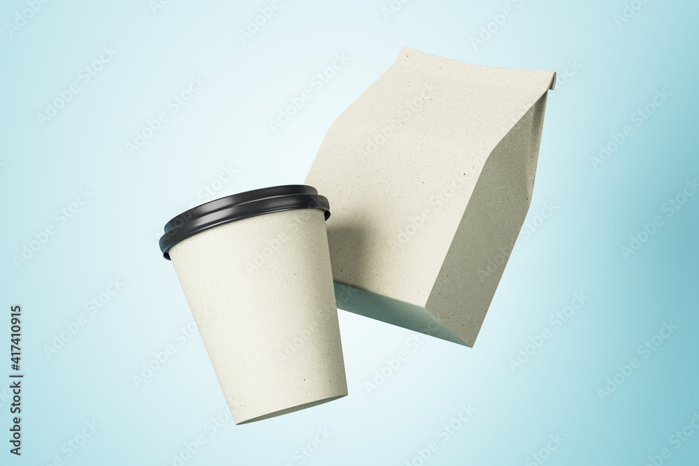 白色纸杯和白色咖啡包装，蓝色背景下有你的标志的复制空间。模仿