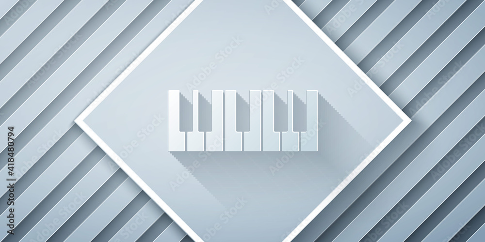 Paper cut Music synthesizer icon isolated on grey background. Electronic piano. Paper art style. Vec