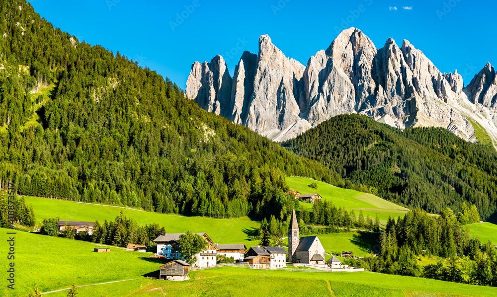 View of Val di Funes with the Chruch of Santa Maddalena in the Dolomites Mountains. UNESCO world her