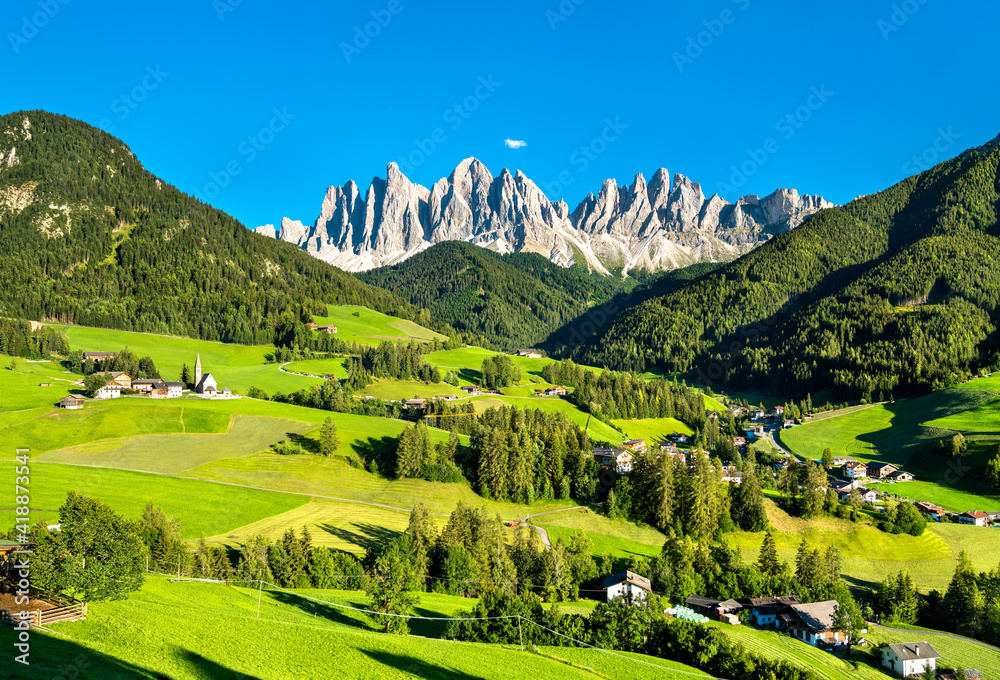 View of Val di Funes with the Chruch of Santa Maddalena in the Dolomites Mountains. UNESCO world her