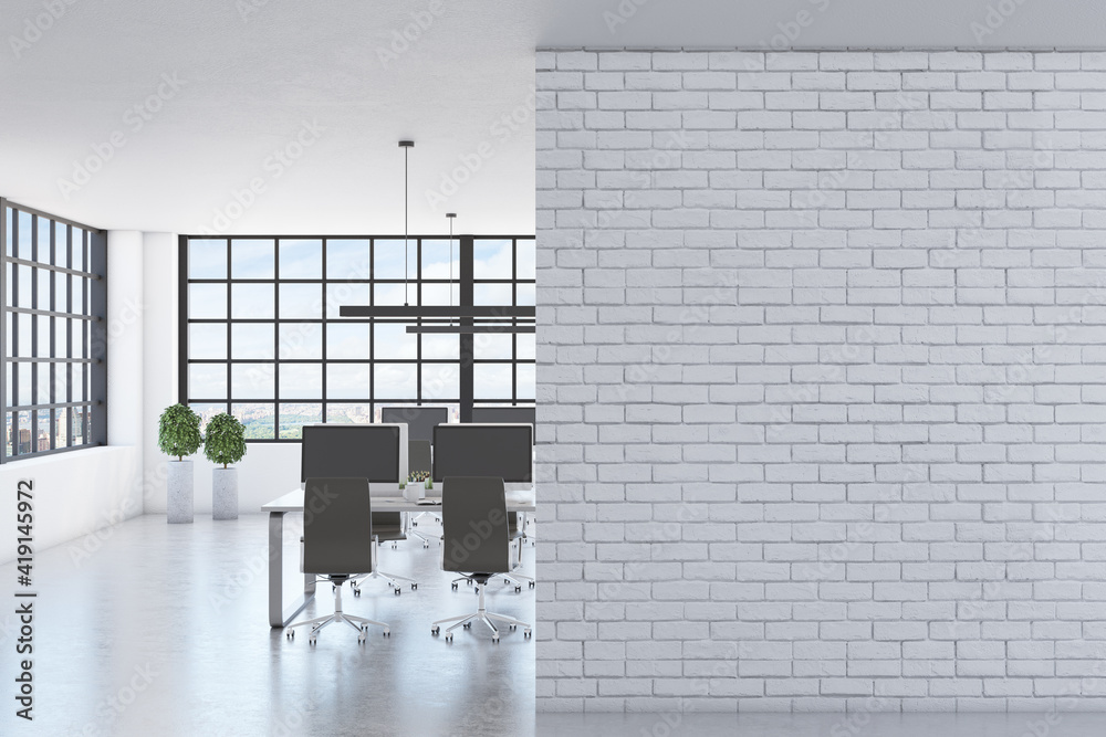Blank white brick wall in modern spacious office with squared window, concrete floor and black chair