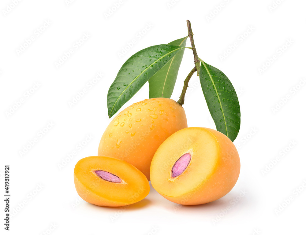 Fresh sweet marian plum with cut in half and leaves on white background.