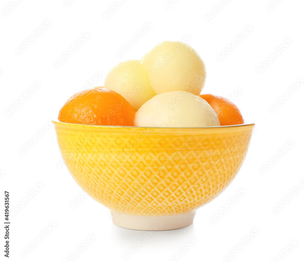 Bowl with sweet melon balls on white background
