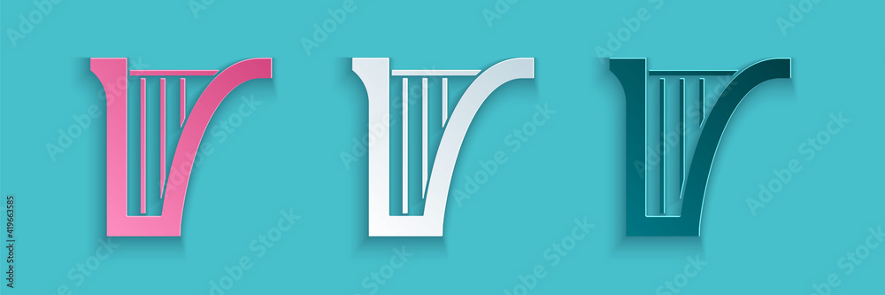 蓝色背景上隔离的剪纸竖琴图标。古典乐器，或赫斯特拉弦乐器