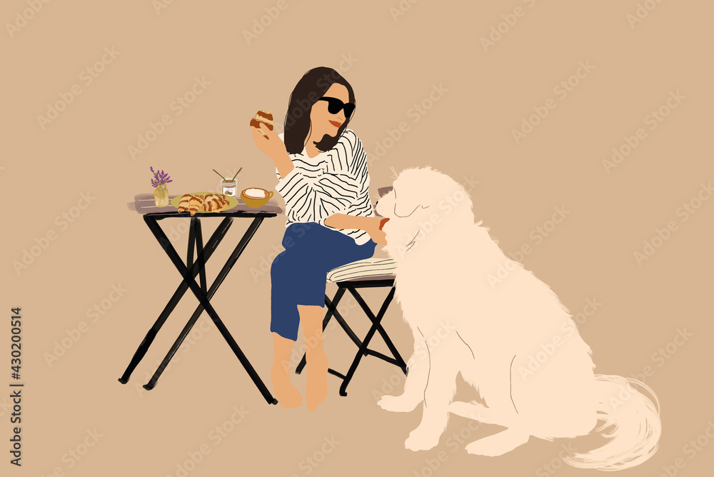 Cheerful woman sitting at a table with croissants and a big white dog and having lunch. Spend time o