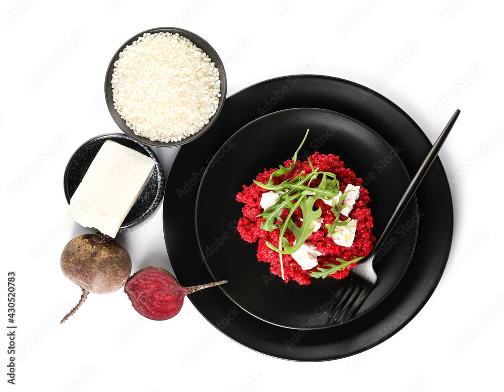 Plate with tasty beet risotto and ingredients on white background