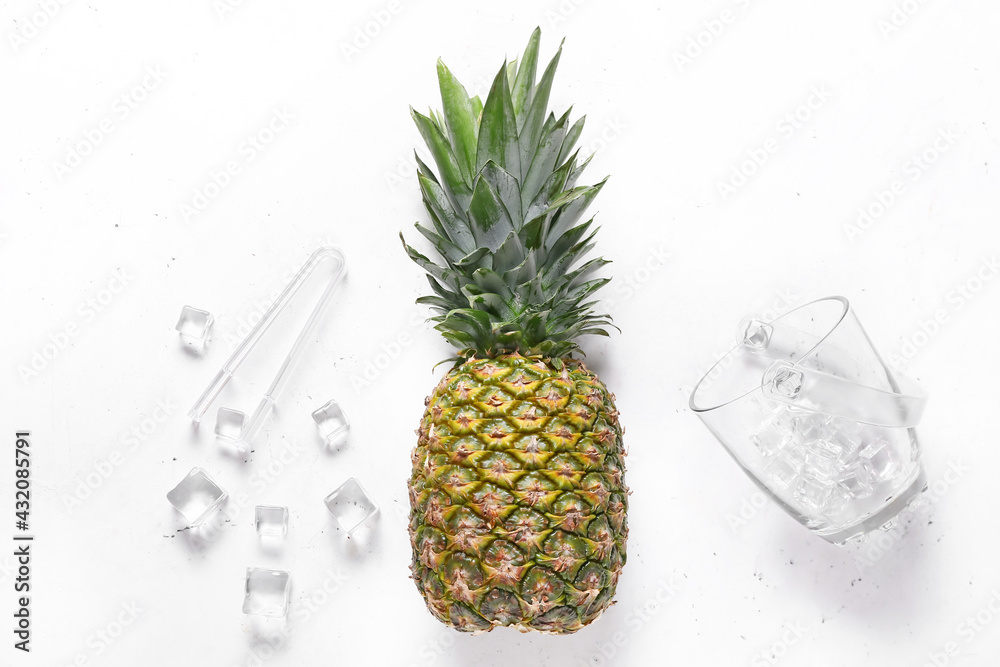 Fresh pineapple with ice cubes on white background