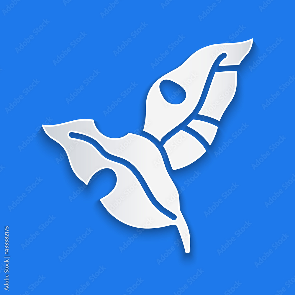 Paper cut Tropical leaves of palm tree icon isolated on blue background. Paper art style. Vector