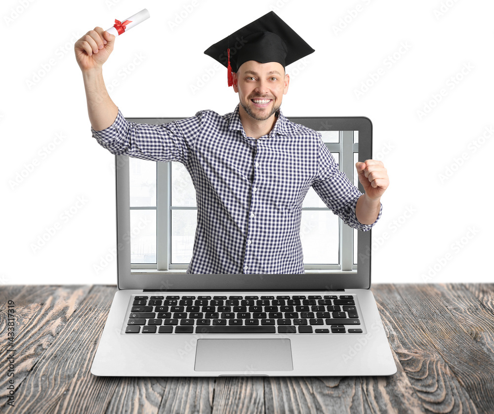 Male graduating student on screen of laptop against white background