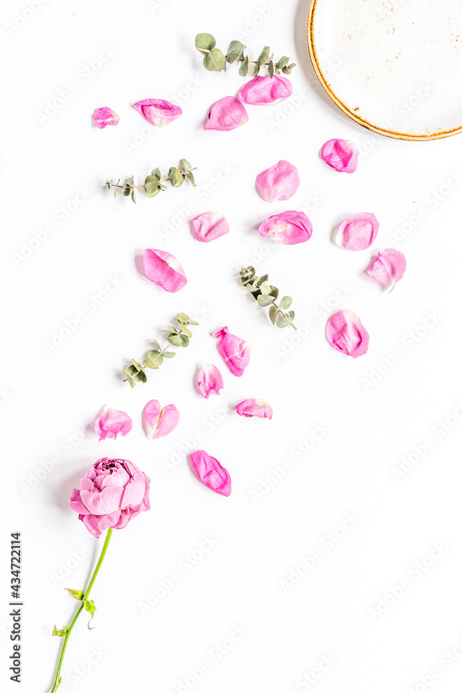 spring floral design with rose petals in soft light top view mock-up