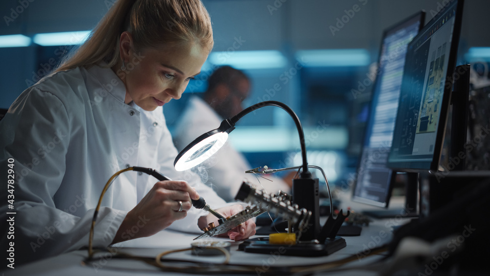 Modern Electronics Research and Development Facility: Beautiful Caucasian Female Engineer Does Compu