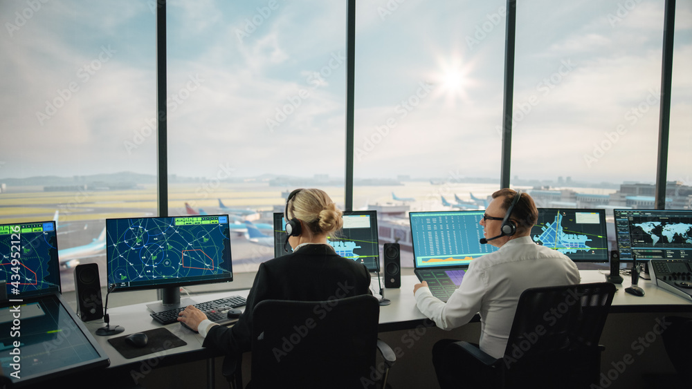 Diverse Air Traffic Control Team Working in a Modern Airport Tower. Office Room is Full of Desktop C