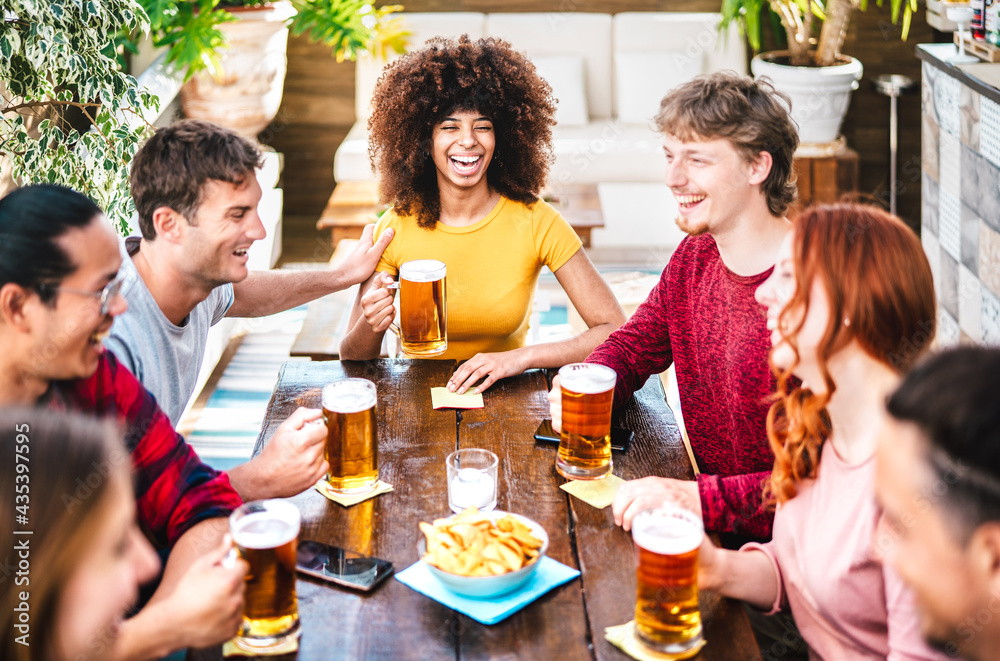 Young gen z people drinking beer at brewery bar terrace - Friendship life style concept with young m