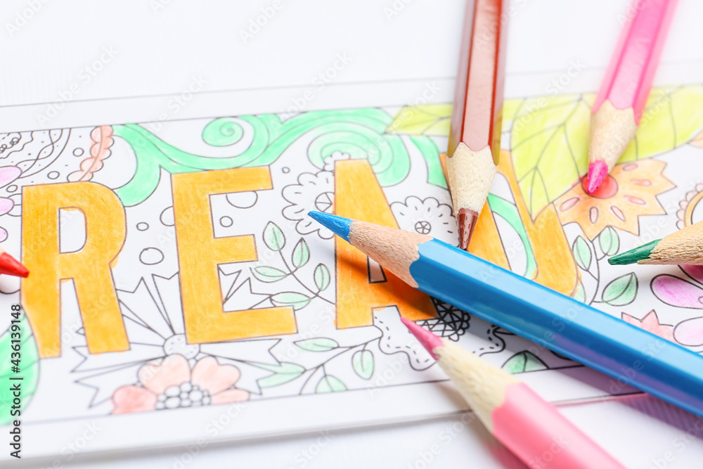 Cute bookmark with pencils on white background, closeup