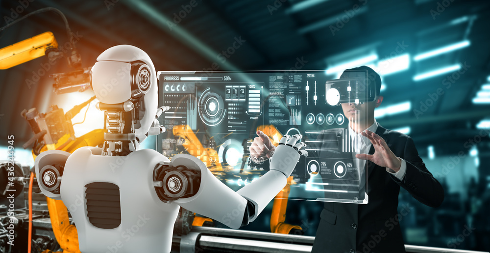 机械化工业机器人和人类工人在未来工厂合作。人工概念