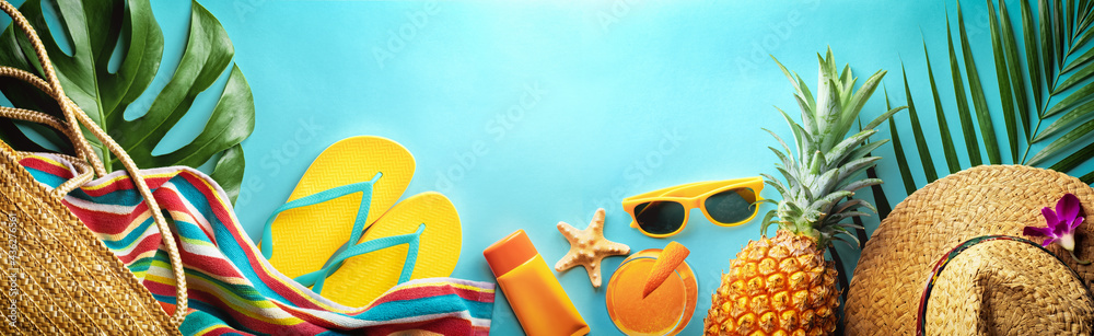 Summer beach vacation and accessories on blue background