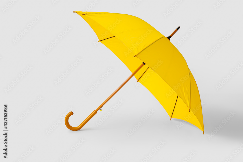 浅背景时尚黄色雨伞