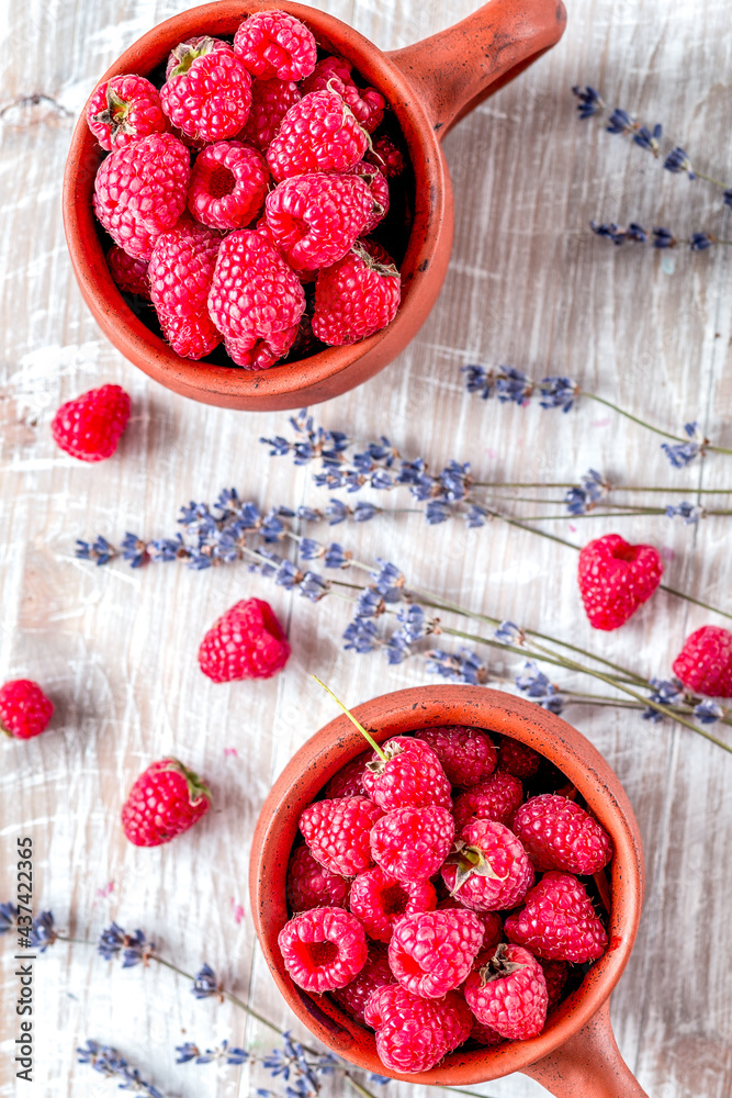 raspberry composition with dry lavender rustic background top view