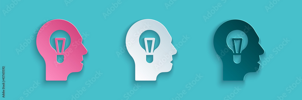 Paper cut Human with lamp bulb icon isolated on blue background. Concept of idea. Paper art style. V