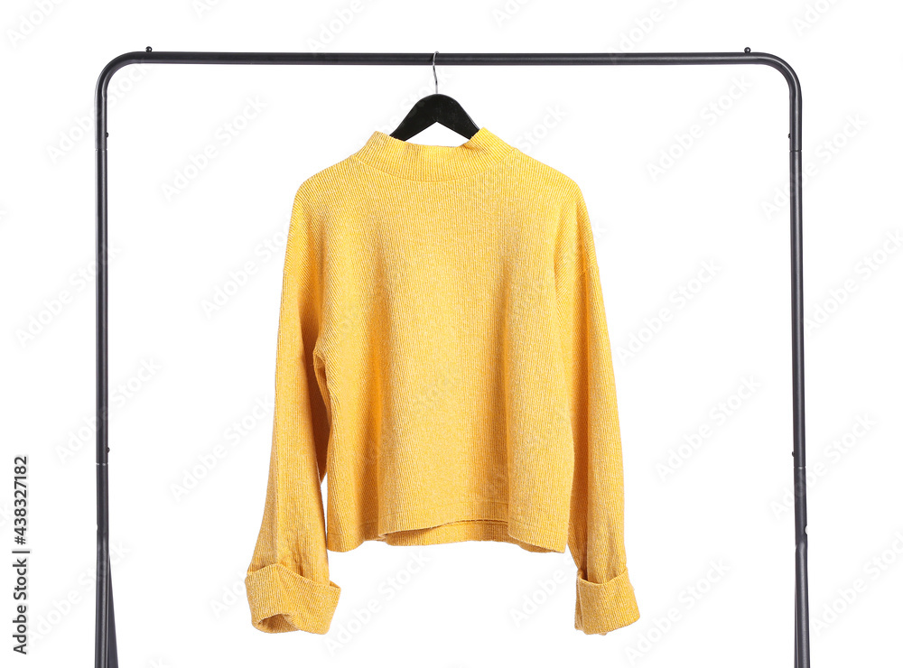 Rack with sweater on white background