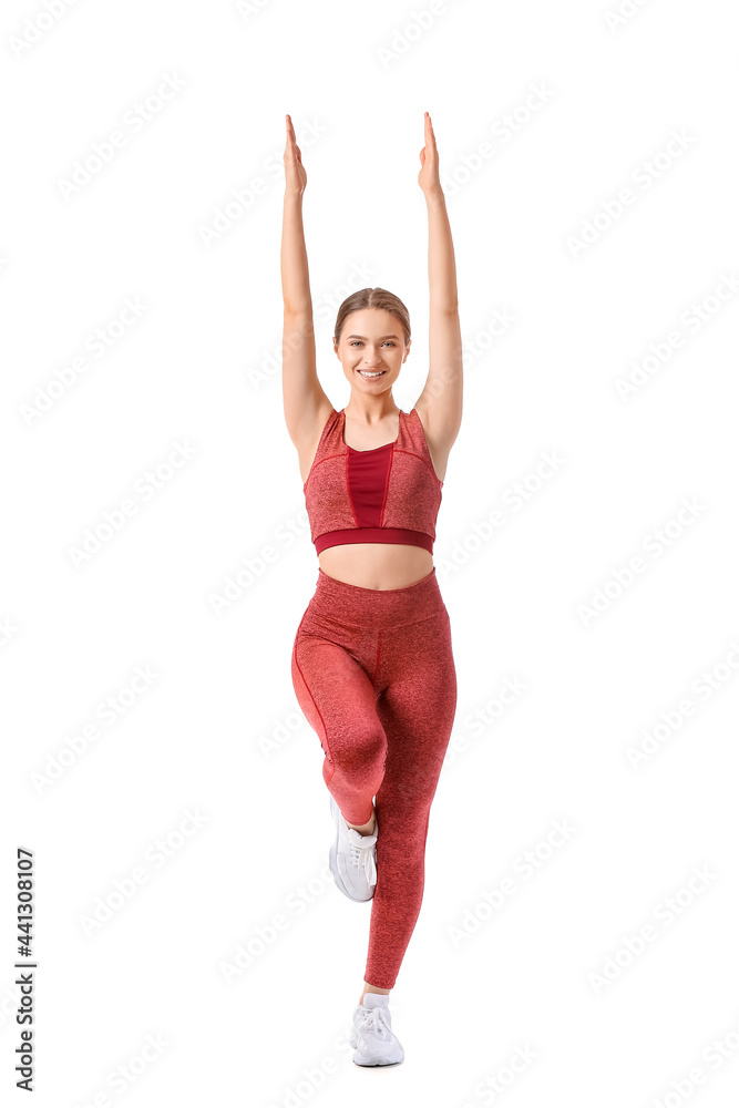 运动型年轻女子在白色背景下做瑜伽