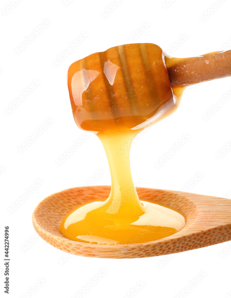 白底蜂蜜和勺子木勺