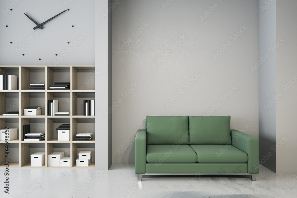 办公室的现代化等候区，配有书柜、舒适的绿色沙发和墙上的模型。模型