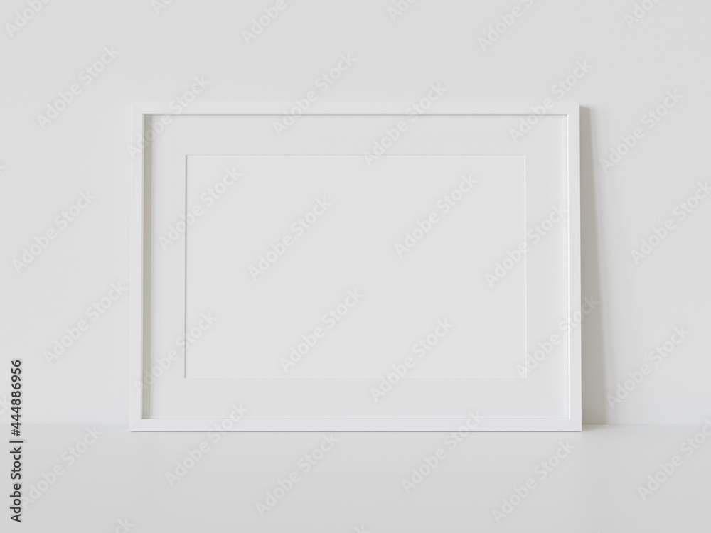 室内模型中白色框架靠在白色地板上。墙上相框的模板3D ren