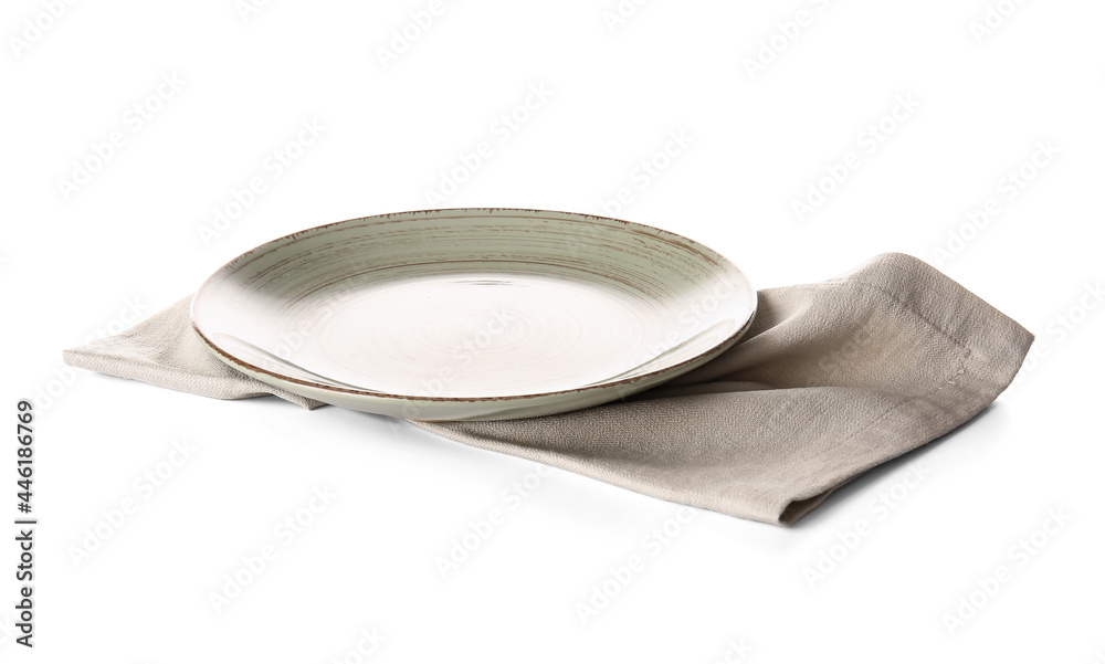 Fabric napkin and plate on white background
