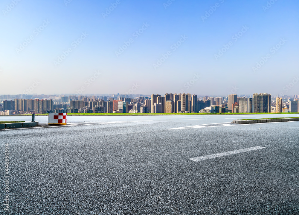 Road and modern city buildings background