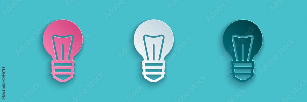蓝色背景上有创意图标概念的剪纸灯泡。能量和创意符号。