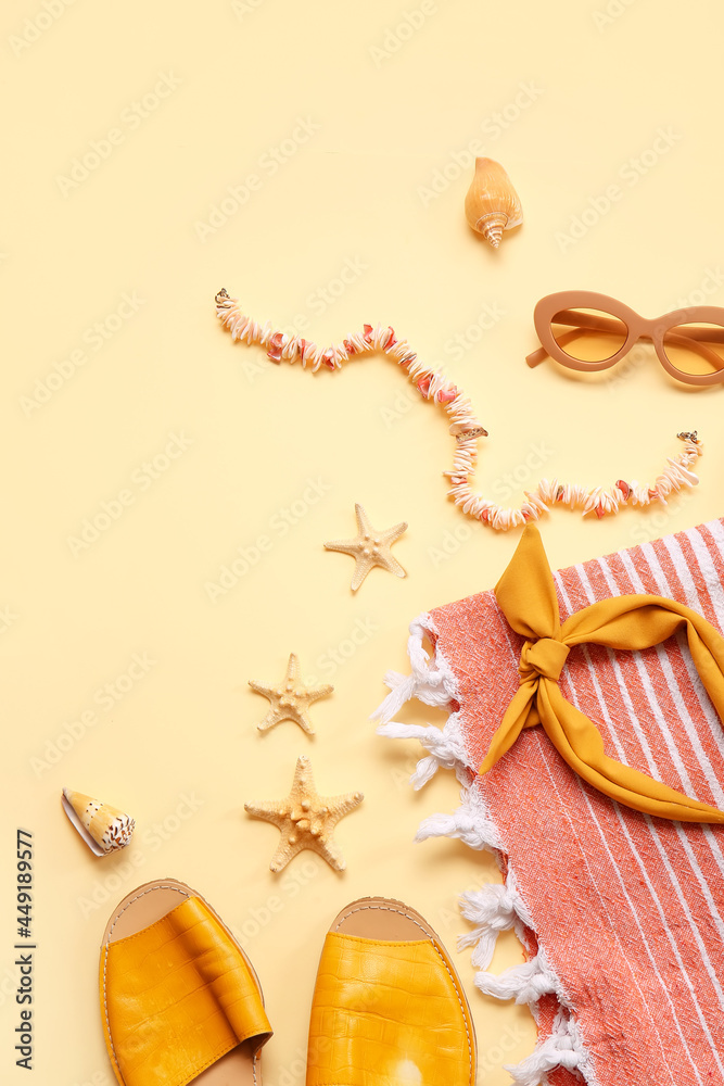 Composition with beach accessories on color background, closeup