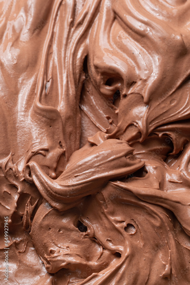 巧克力口味冰淇淋-全框架细节。巧克力Ice c的棕色表面纹理特写