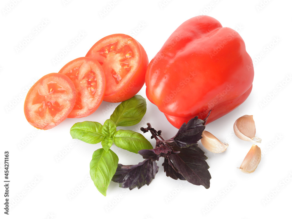 Fresh basil, garlic, tomato and bell pepper on white background