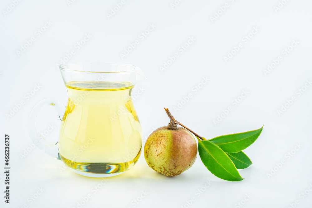 Camellia fruit and tea seed oil on white background