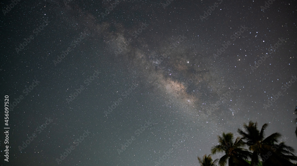 Milky Way with stars shining brightly beautiful at night on the sky background in Phuket Thailand Am