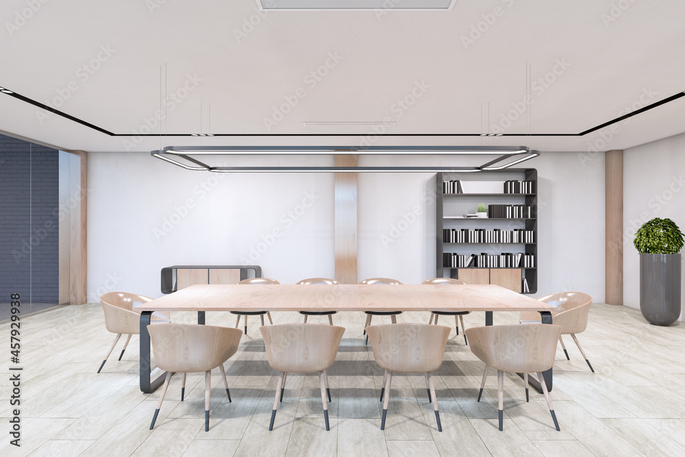 现代混凝土和木制会议室内部，配有桌子、装饰性植物和其他物品。